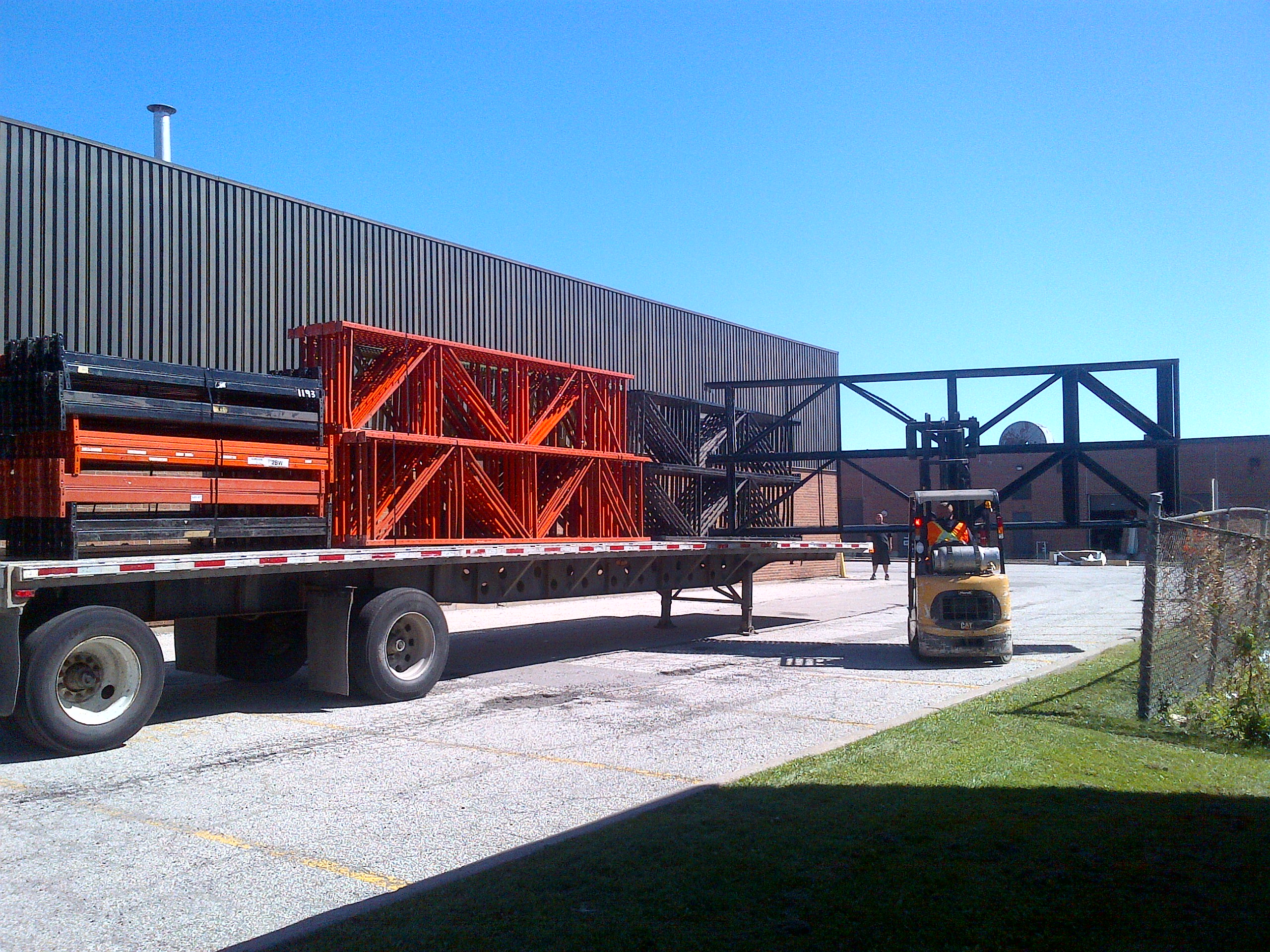 unloading pallet rack from truck